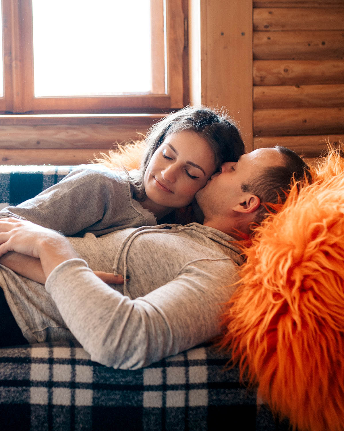 guy and girl in the house near the window overlooking
